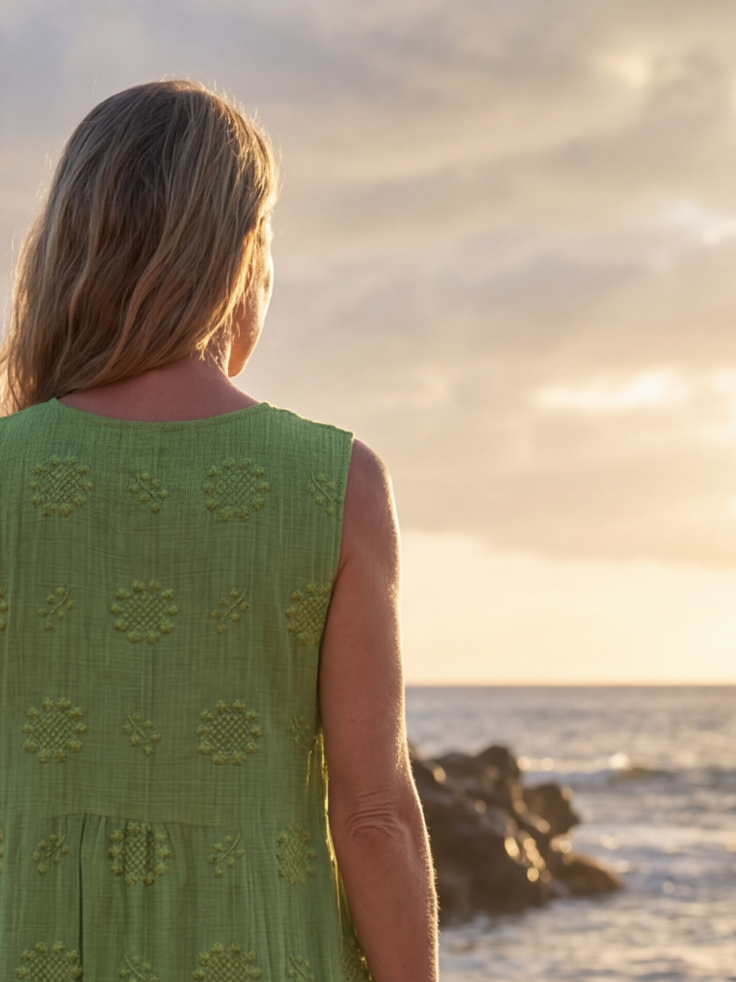 Green textured sleeveless midi dress for women. Relaxed fit, pull-on style, great for summer casual & garden parties.
