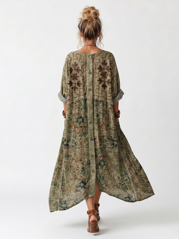 Stylish women's embroidered midi dress with a functional button front, v-neck, and a flattering oversized design.