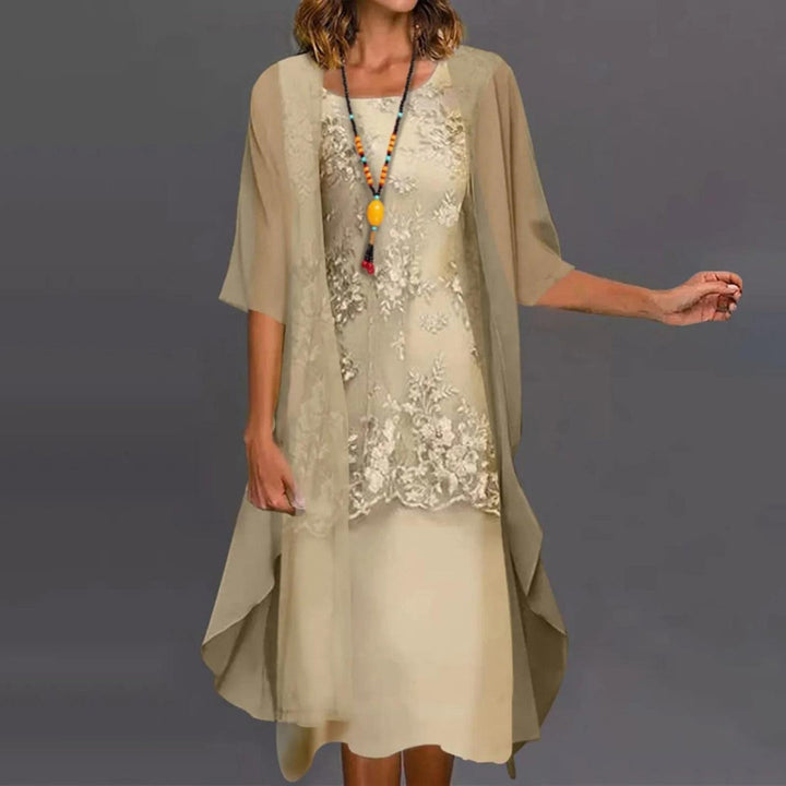 Elegant women's two-piece knee-length dress with 3/4 sleeves & round neck, perfect for versatile fashion.