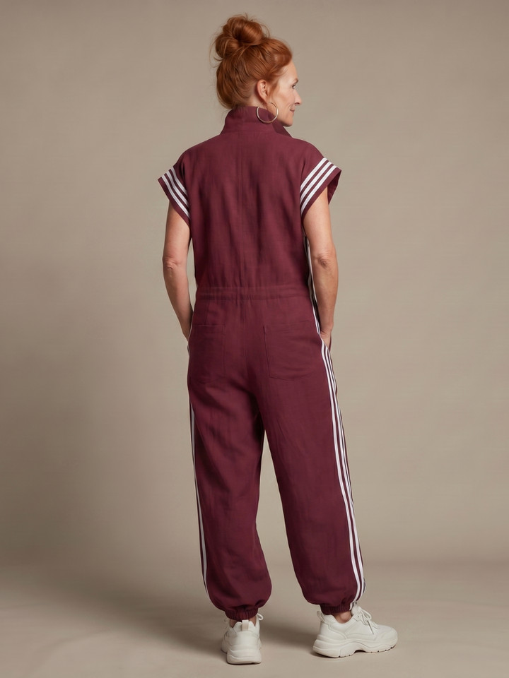Casual women's relaxed fit jumpsuit with a convenient zip front and eye-catching stripe details.