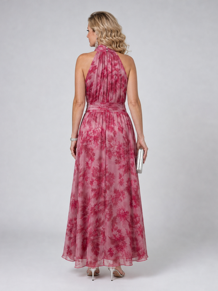 Chic women's occasion wear: an elegant halter neck midi dress with a flattering flowing silhouette.