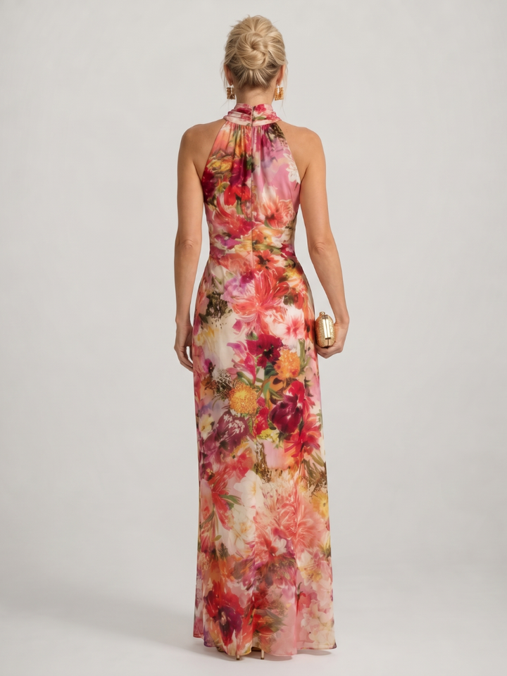Sleeveless women's halter neck floral print maxi dress, a chic and flowy option for warm weather events.