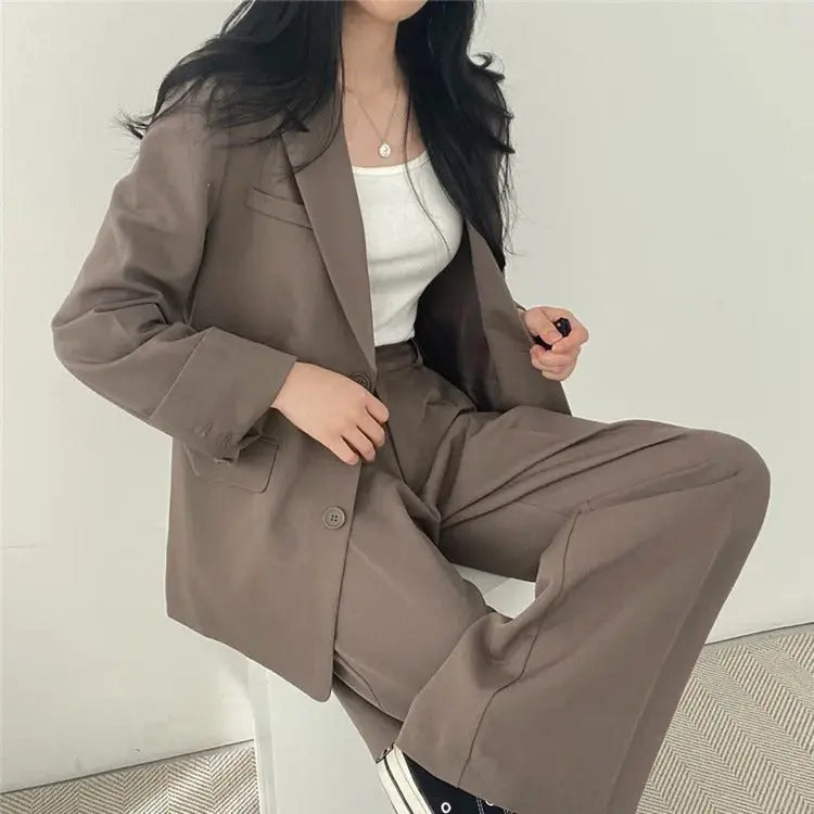 Women's chic business suit with a perfectly tailored blazer & comfortable trousers.
