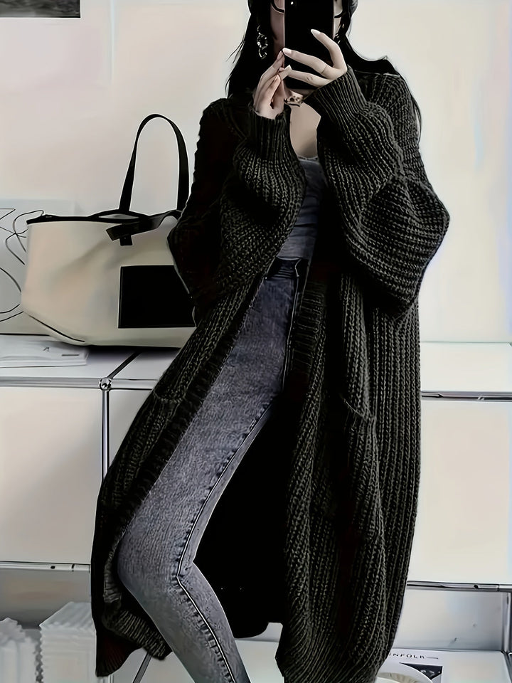 Stylish woman wearing a V-neck button-front knit cardigan sweater, ideal for chic layering.