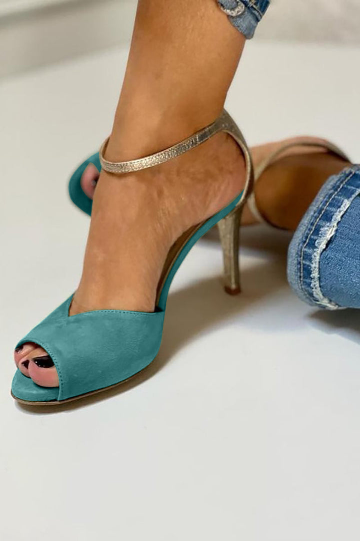 Elegant women's shiny open-toe ankle strap heels. Fashionable party shoes with a glamorous strappy design.