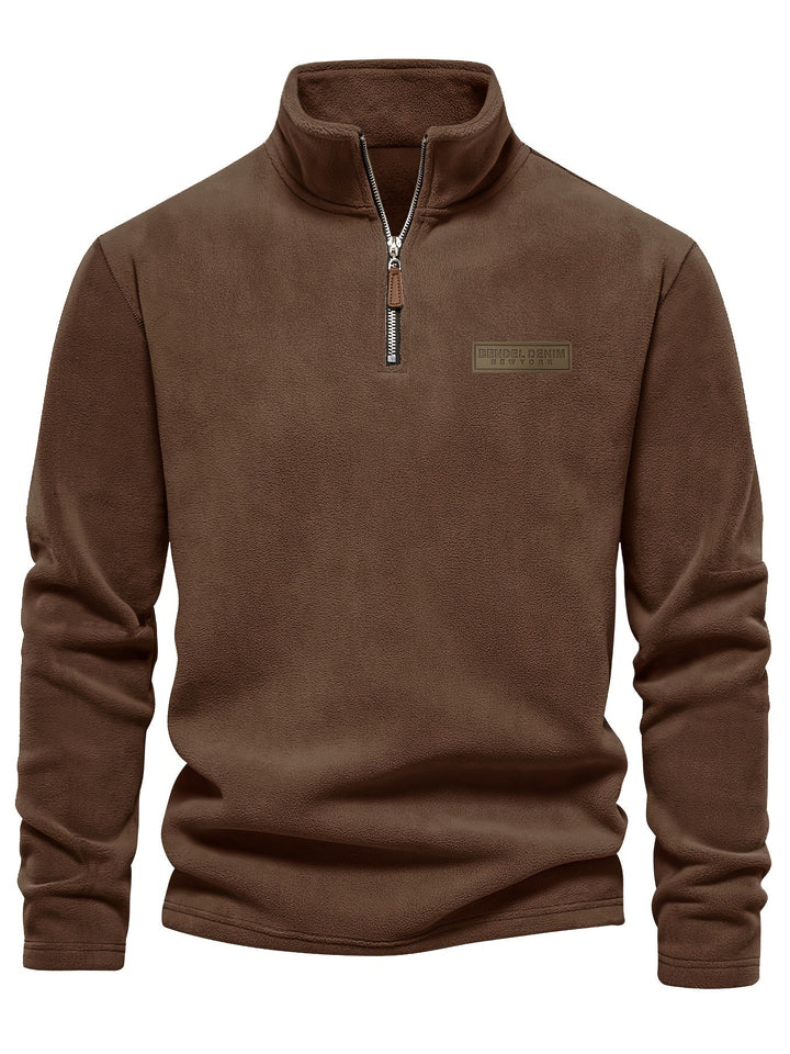 Model wearing a cozy unisex fleece half-zip pullover, enjoying ultimate warmth on a cold winter day.