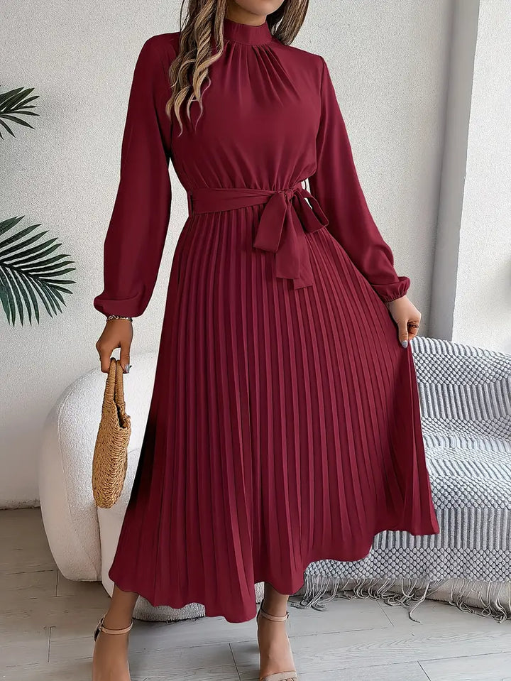 Elegant women's long-sleeve midi dress, featuring a flattering belted waist.