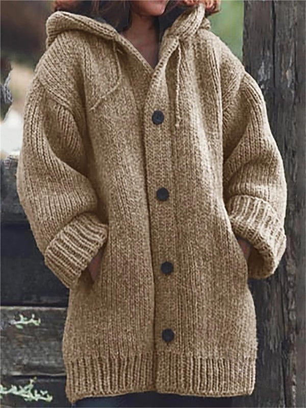 Woman wearing a chic oversized hooded cardigan over jeans, ideal for relaxed everyday fashion.
