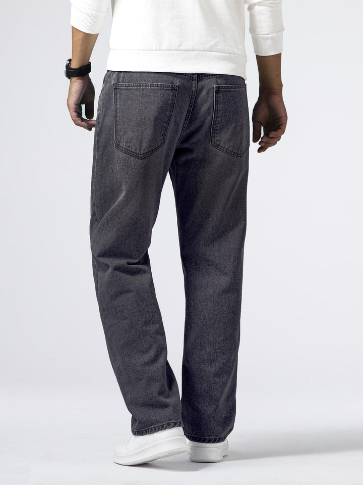 Detailed view of men's straight leg jeans in classic washed blue denim, comfortable and versatile fit.