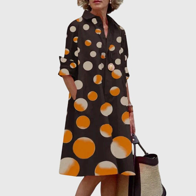 Stylish woman accessorizing a long sleeve casual dress, demonstrating its versatile fashion potential.
