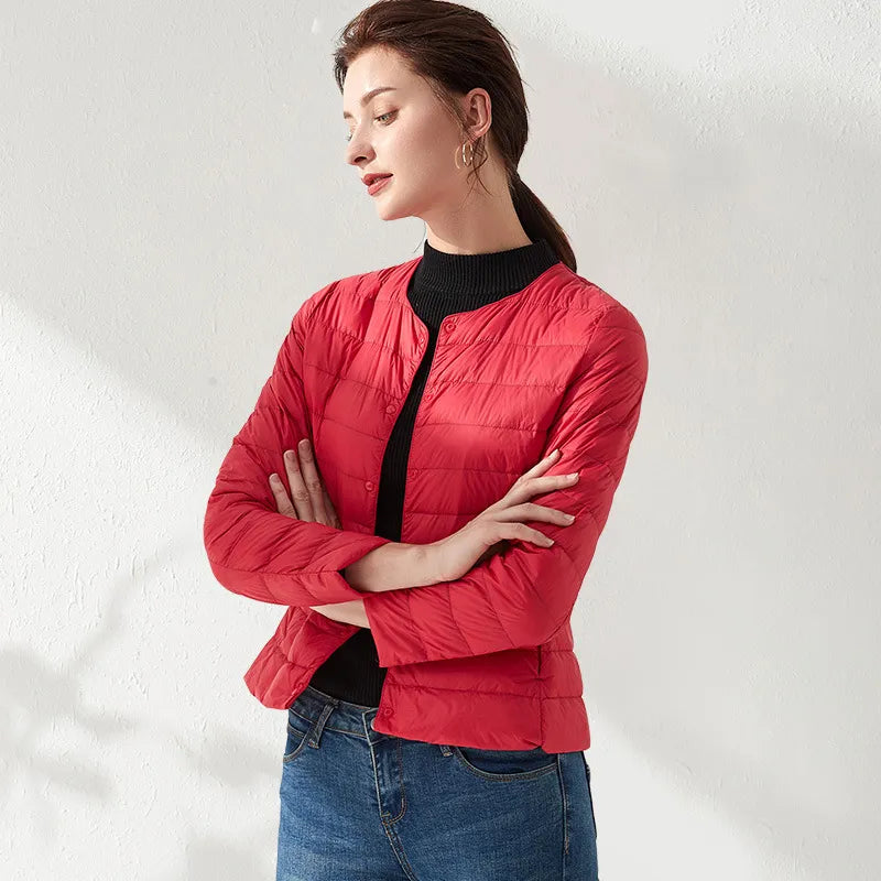 Modern women's slimming puffer jacket, lightweight and collarless. Perfect for versatile spring and fall outfits.
