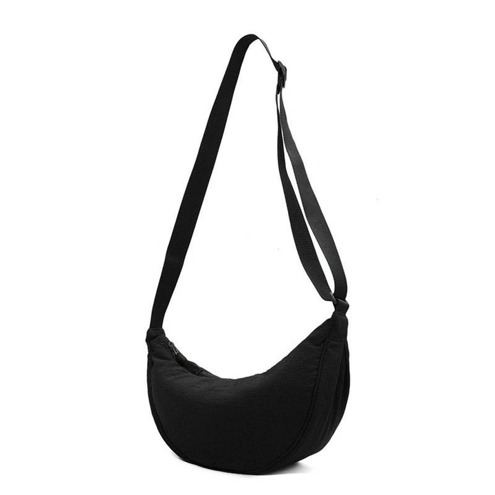 Stylish Black Half Moon Crossbody Bag, a versatile women's shoulder purse for day or evening.