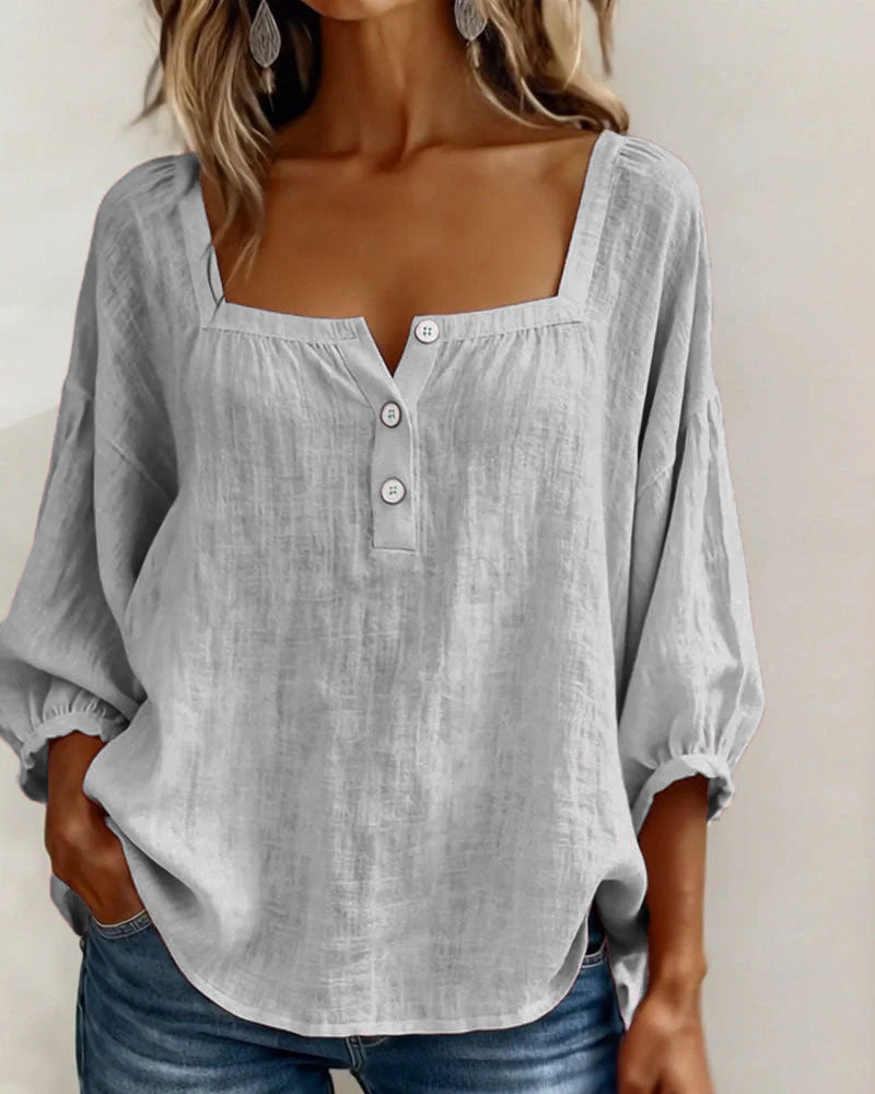Spring/summer women's puff sleeve blouse, relaxed and stylish for versatile looks.