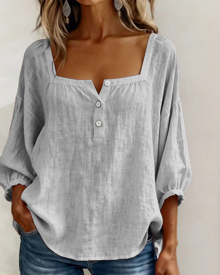 Spring/summer women's puff sleeve blouse, relaxed and stylish for versatile looks.