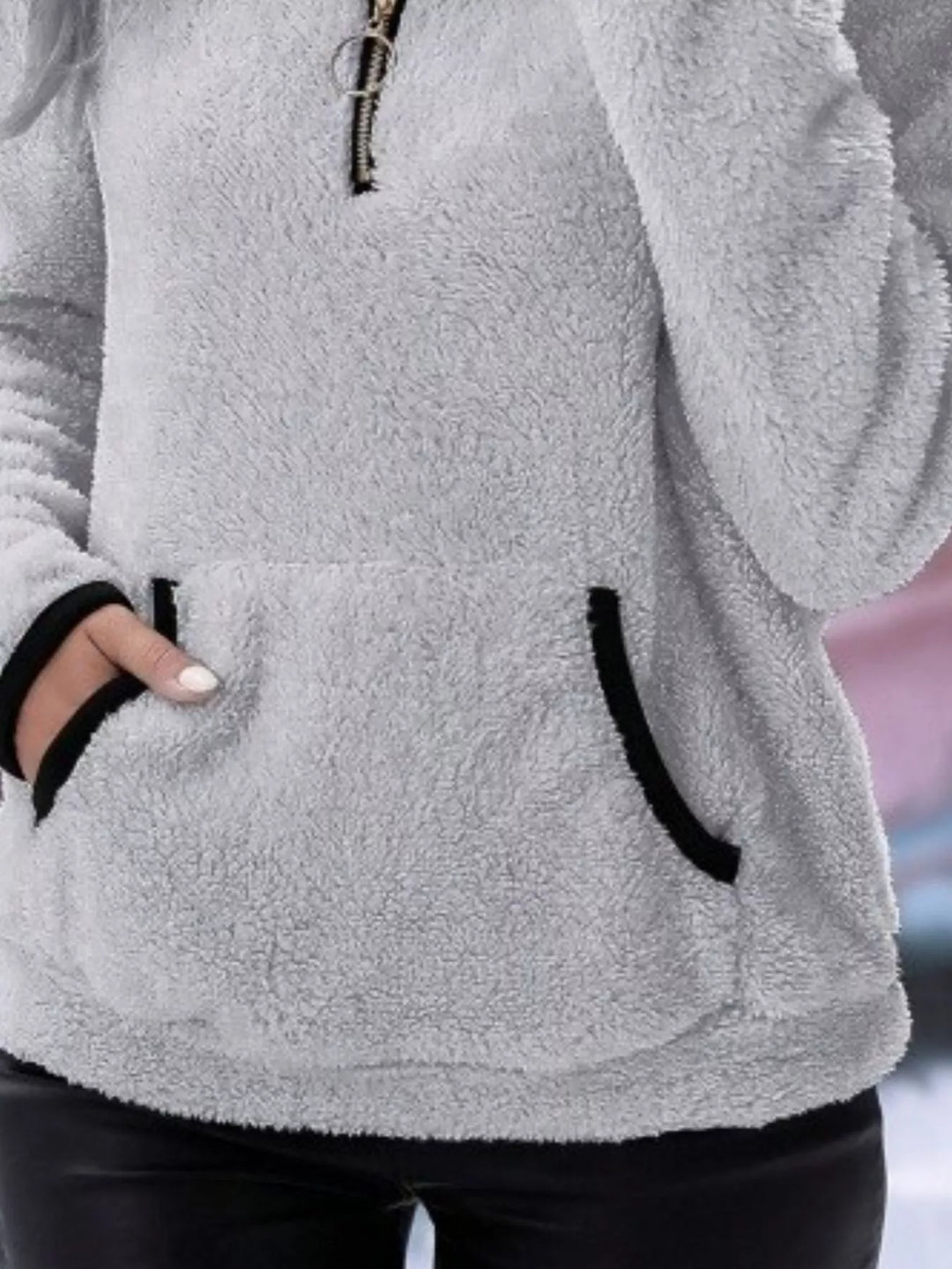Modern women's half-zip sweater, offering relaxed fit and cozy comfort.