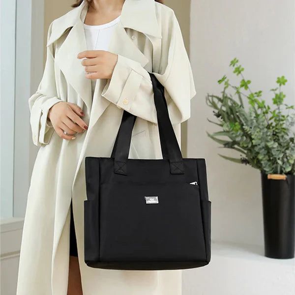 Violet lightweight waterproof shoulder bag for women. Perfect everyday carry & travel essential.