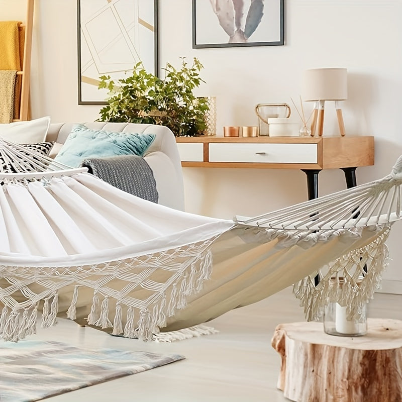 Double Tusheng hammock, vibrant bohemian stripes & fringe tassels for comfort.
