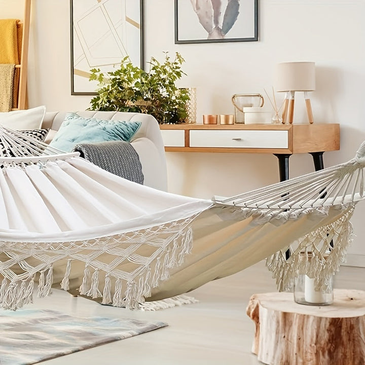 Double Tusheng hammock, vibrant bohemian stripes & fringe tassels for comfort.