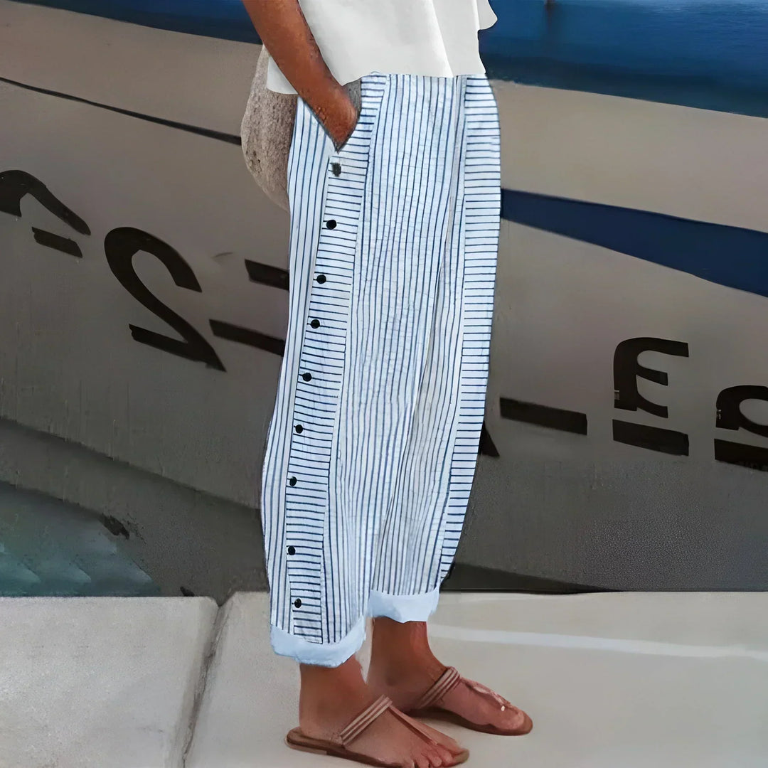 Women's lightweight striped trousers with button details, relaxed fit. Perfect for summer casual wear & travel.