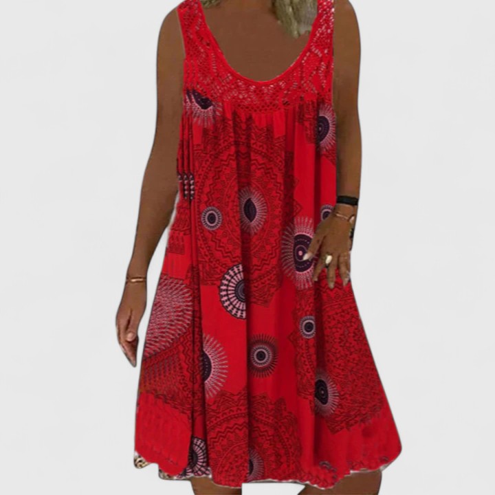 Flowy women's summer boho dress featuring a vibrant ethnic mandala print, ideal for casual day wear.