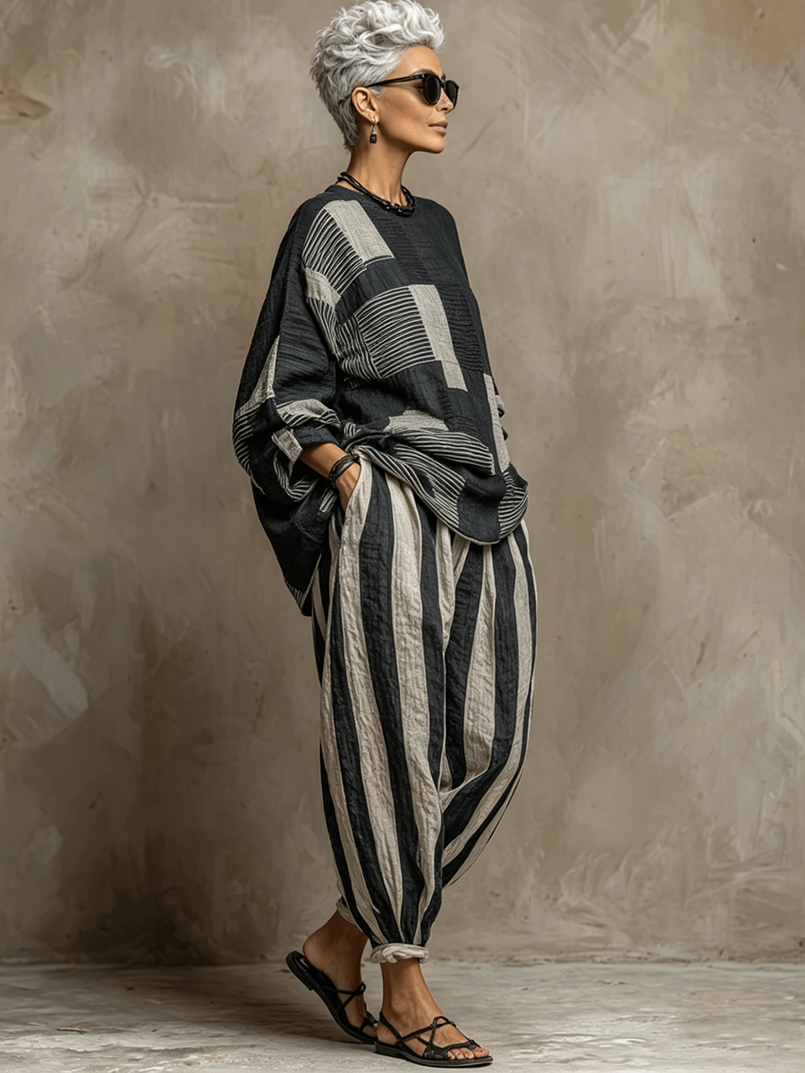 Stylish women's colour-block long sleeve top paired with trendy striped wide-leg trousers for a chic two-piece set.