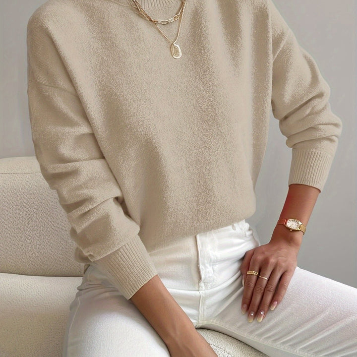Fashionable high neck long sleeve ladies' jumper, perfect for cool seasons.
