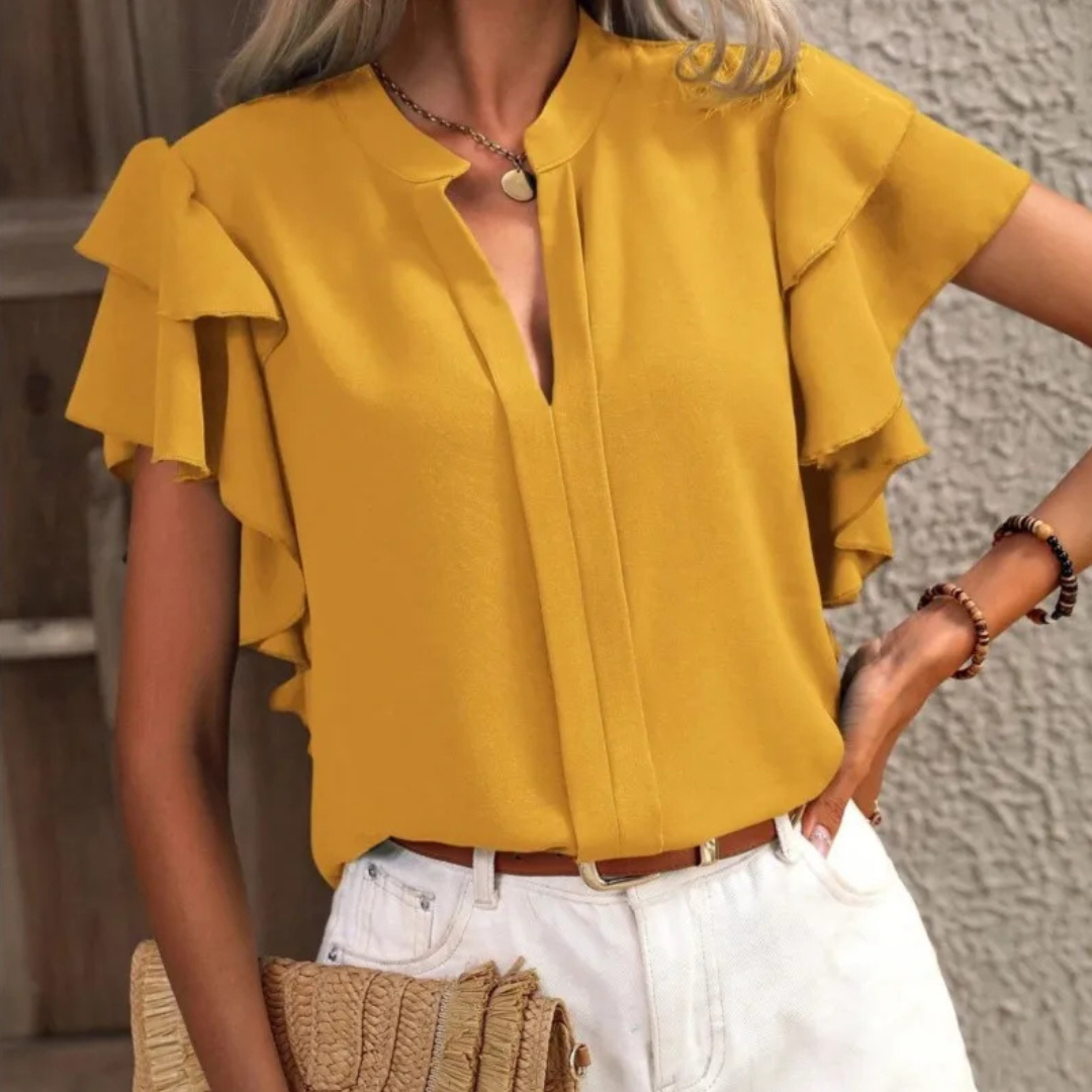 Chic women's V-neck blouse with ruffle details. Perfect workwear or elegant casual spring/summer top.