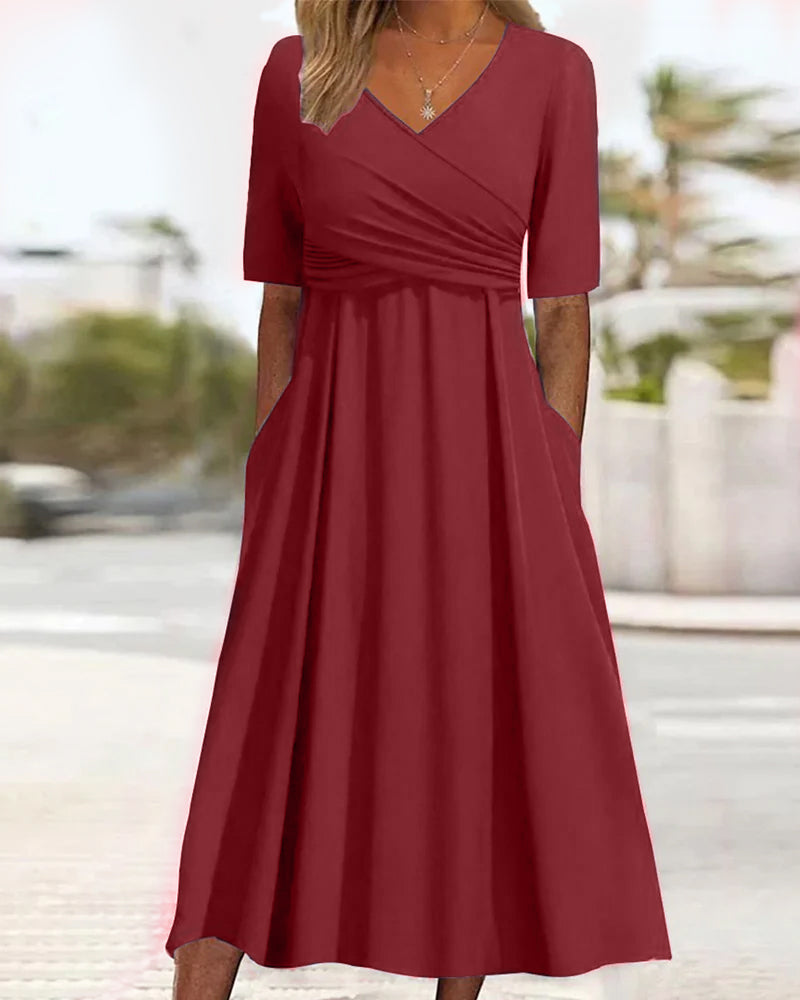 Comfortable women's A-line midi dress in a vibrant red, elegant V-neck style for spring & summer occasions.
