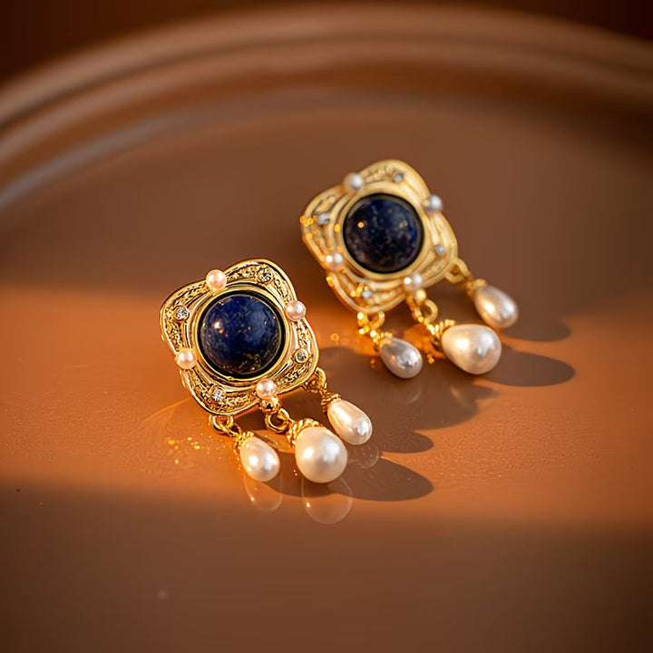 Exquisite royal blue pearl chandelier earrings. Women's elegant, hypoallergenic drop jewelry for a sophisticated look.