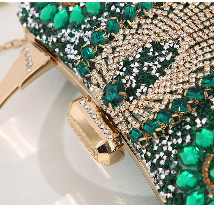 Glamorous metallic evening bag for women, featuring sparkling diamond inlay. Ideal party accessory.