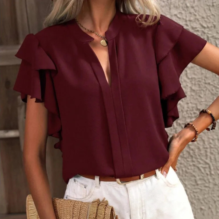 Women's refined V-neck ruffle blouse, short sleeve design. Perfect elegant or casual spring/summer fashion.