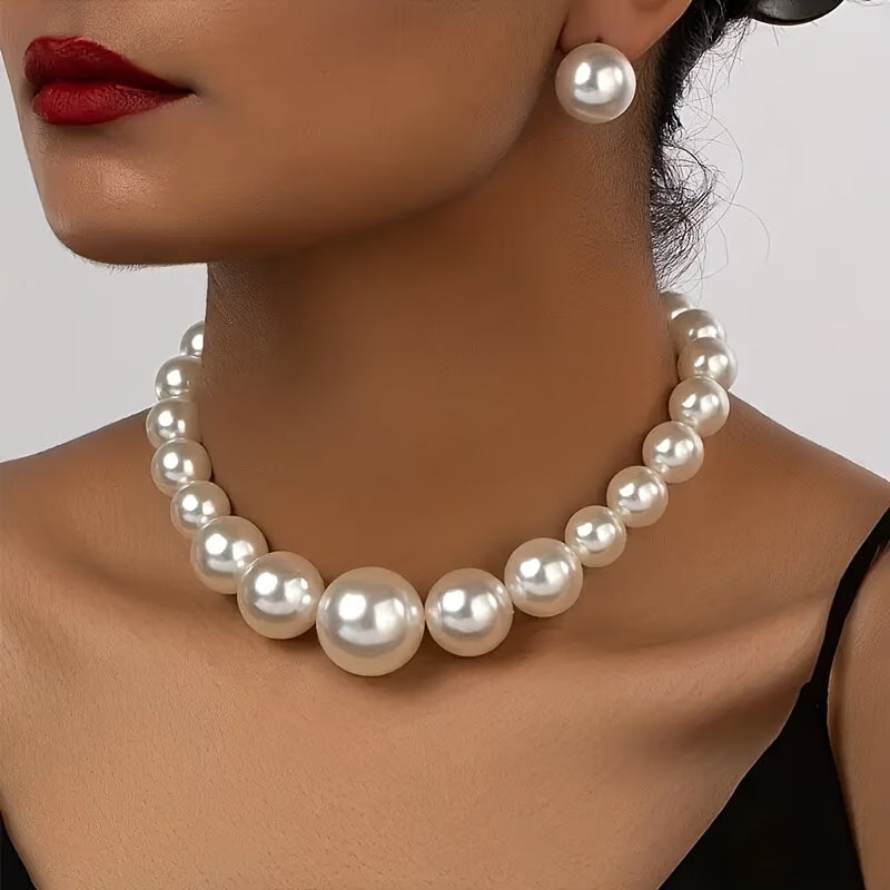 Elegant women's pearl necklace and matching earrings set, a classic jewelry gift for timeless style.
