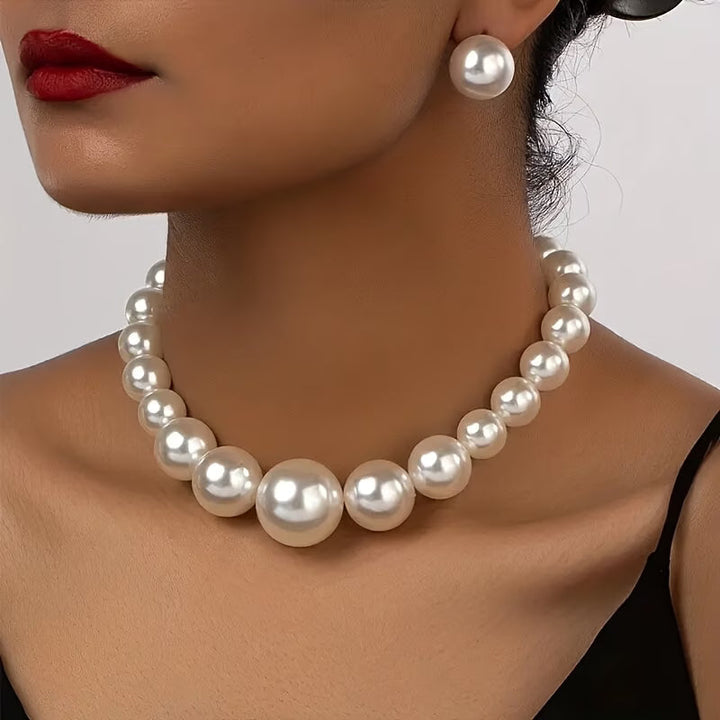 Elegant women's pearl necklace and matching earrings set, a classic jewelry gift for timeless style.