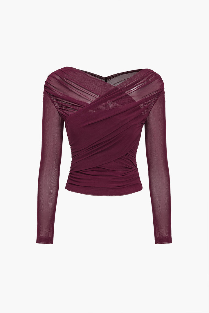 Fitted women's ruched mesh long sleeve top with elegant detailing, a fashionable blouse for party wear.