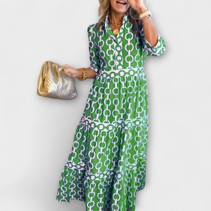 Chic collared midi dress for women with an eye-catching chain print. Three-quarter sleeves, button front.