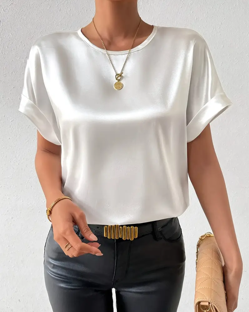 Women's round neck t-shirt in solid color. Smooth, short-sleeve top for casual everyday comfort and versatile style.
