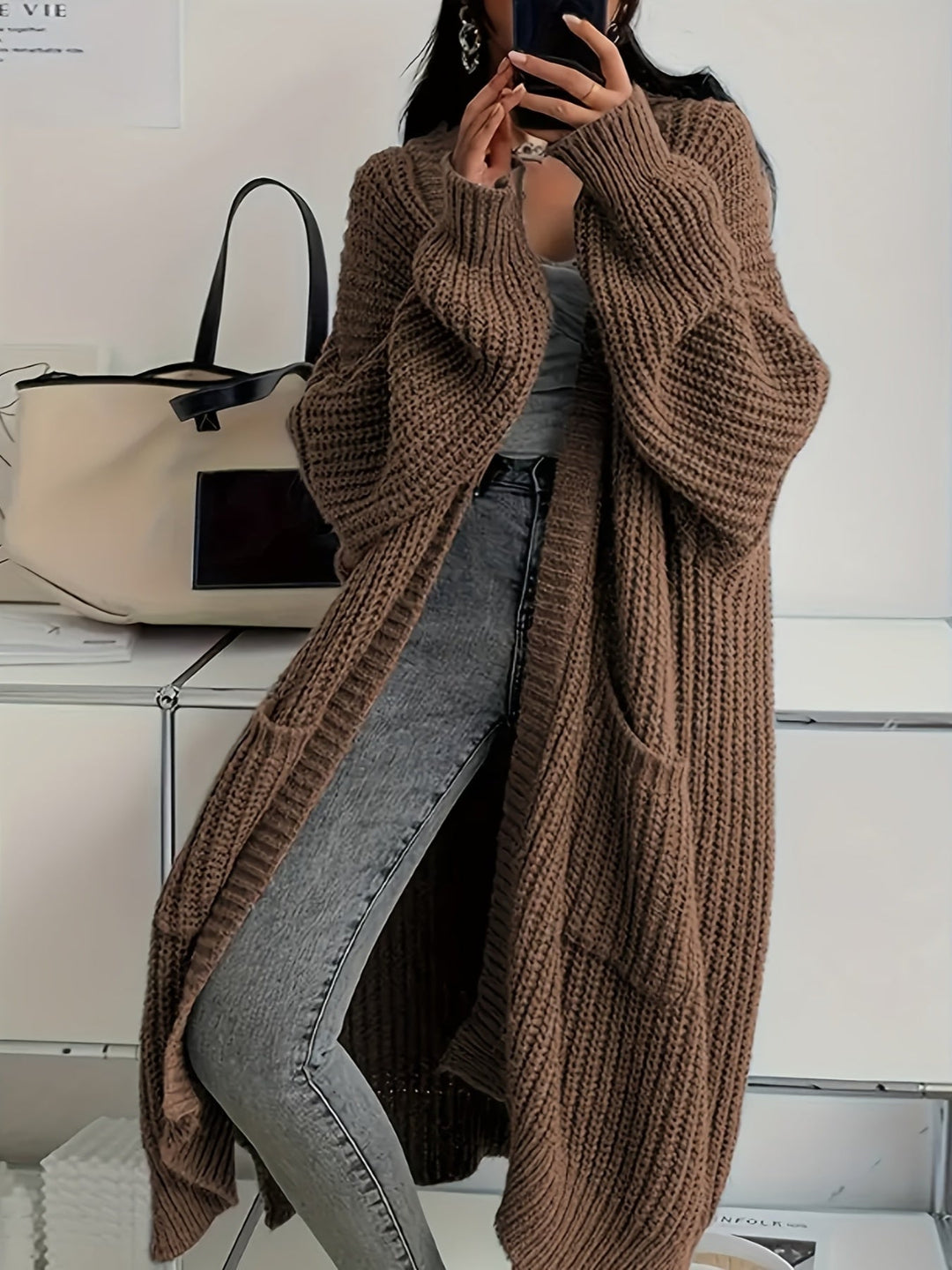 Casual chic women's V-neck cardigan sweater, a versatile knitwear layering piece for autumn.