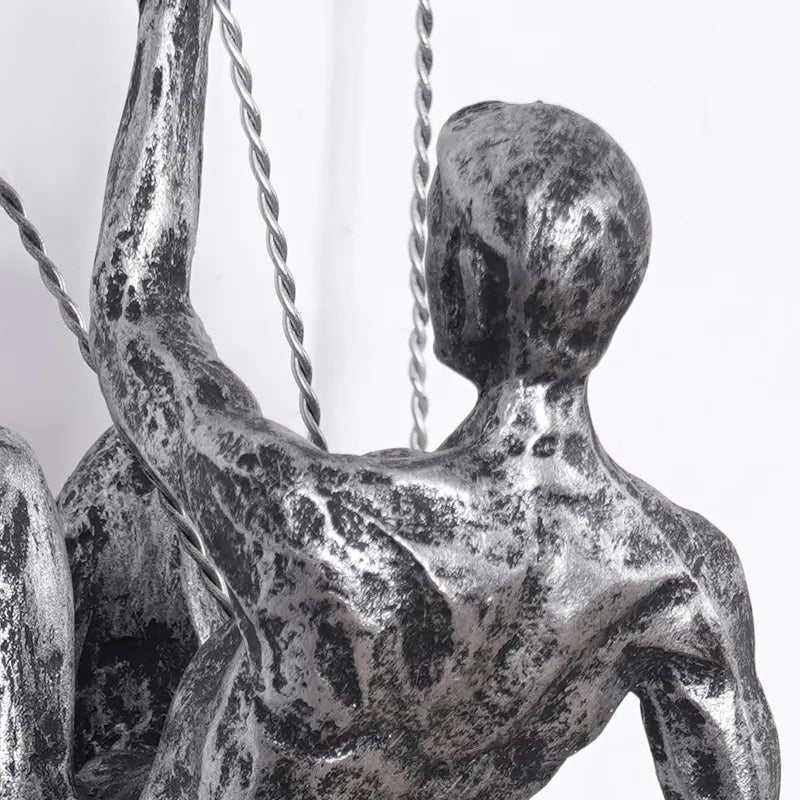 Distinctive climbing figures wall art sculpture set, modern aesthetic.