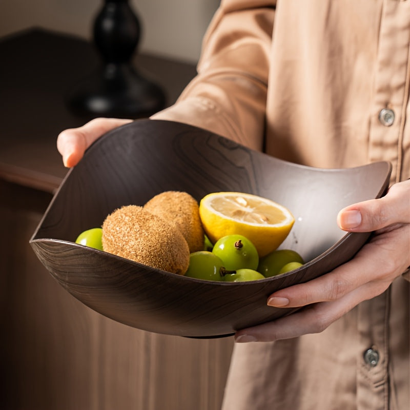 Decorative serving bowl, dark brown wood look, perfect for fruits or snacks on any table.