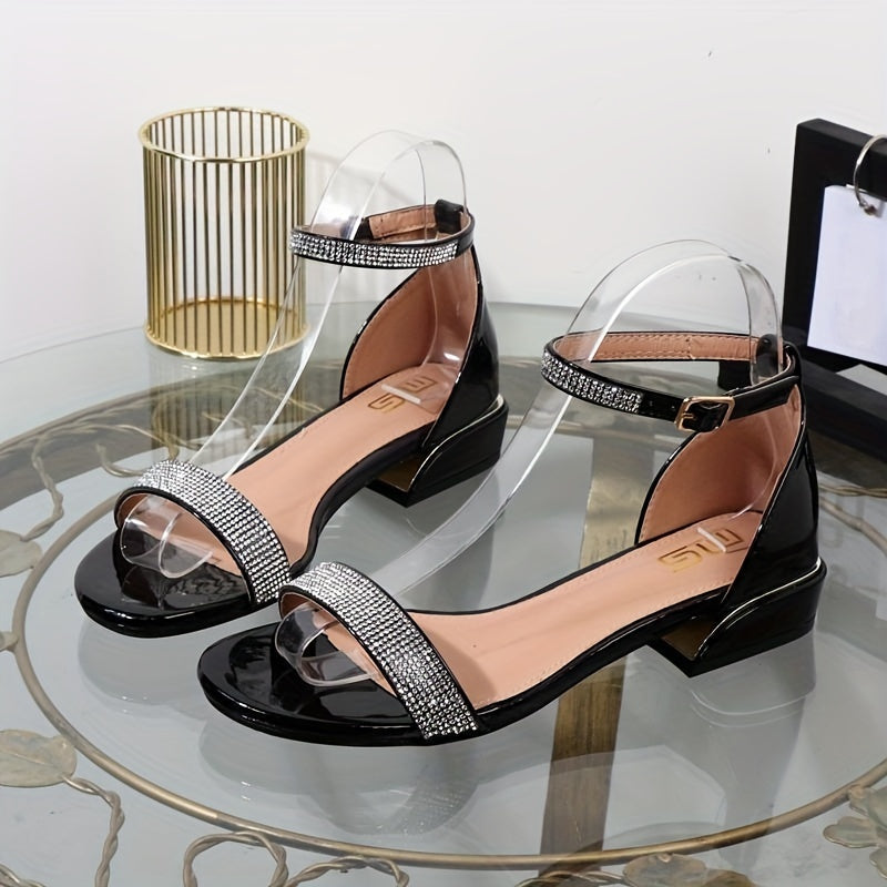 Pair of shiny women's flat sandals with intricate crystal embellishments for summer.
