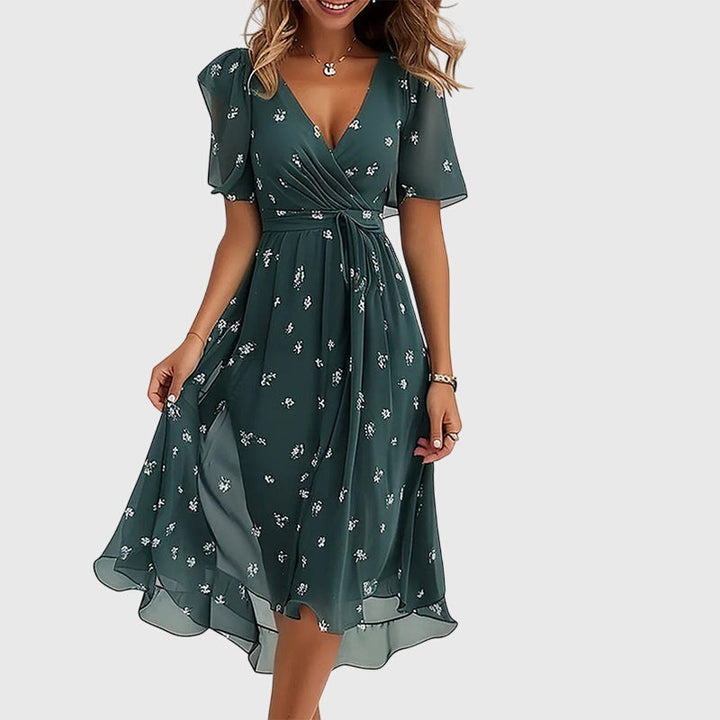 Beautiful women's elegant flowy midi dress, a versatile and chic option with flutter sleeves for any event.