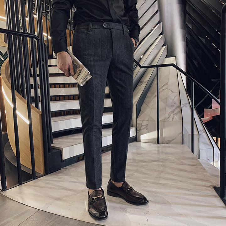 Men's slim-fit herringbone dress pants in a modern tailored style, perfect for office wear or formal events.
