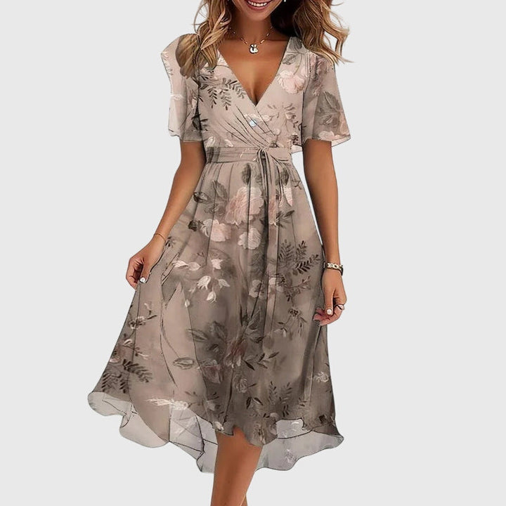 Women's elegant midi dress featuring graceful flutter sleeves and a flattering flowy silhouette, very chic.