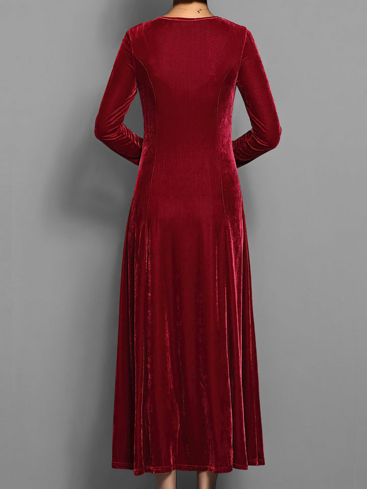 Comfortable women's long sleeve maxi dress featuring a flowing flared skirt & classic round neck.