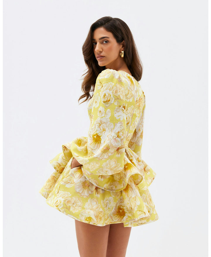 Yellow floral V-neck mini dress with charming ruffles for women, ideal as a casual or party summer outfit.