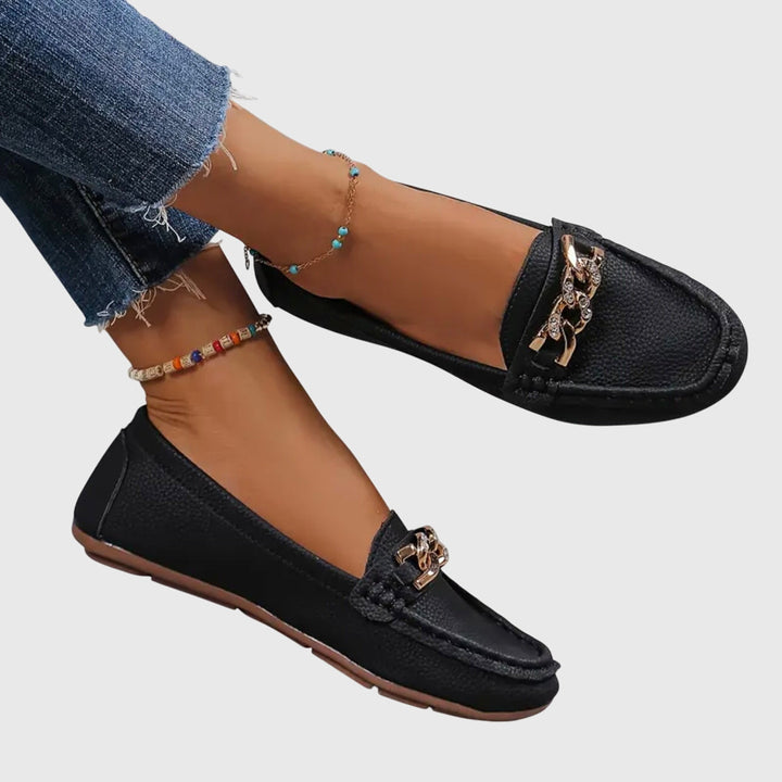 Stylish women's black orthopaedic loafers, perfect for all-day comfort & versatile wear.