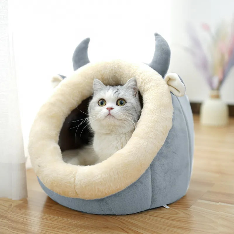Cozy cat cave bed with cute ear design, providing a soft, snuggle retreat for your feline friend.