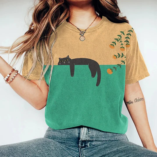 Casual women's two-tone cat graphic t-shirt. Comfortable short sleeve tee with a playful animal print design.