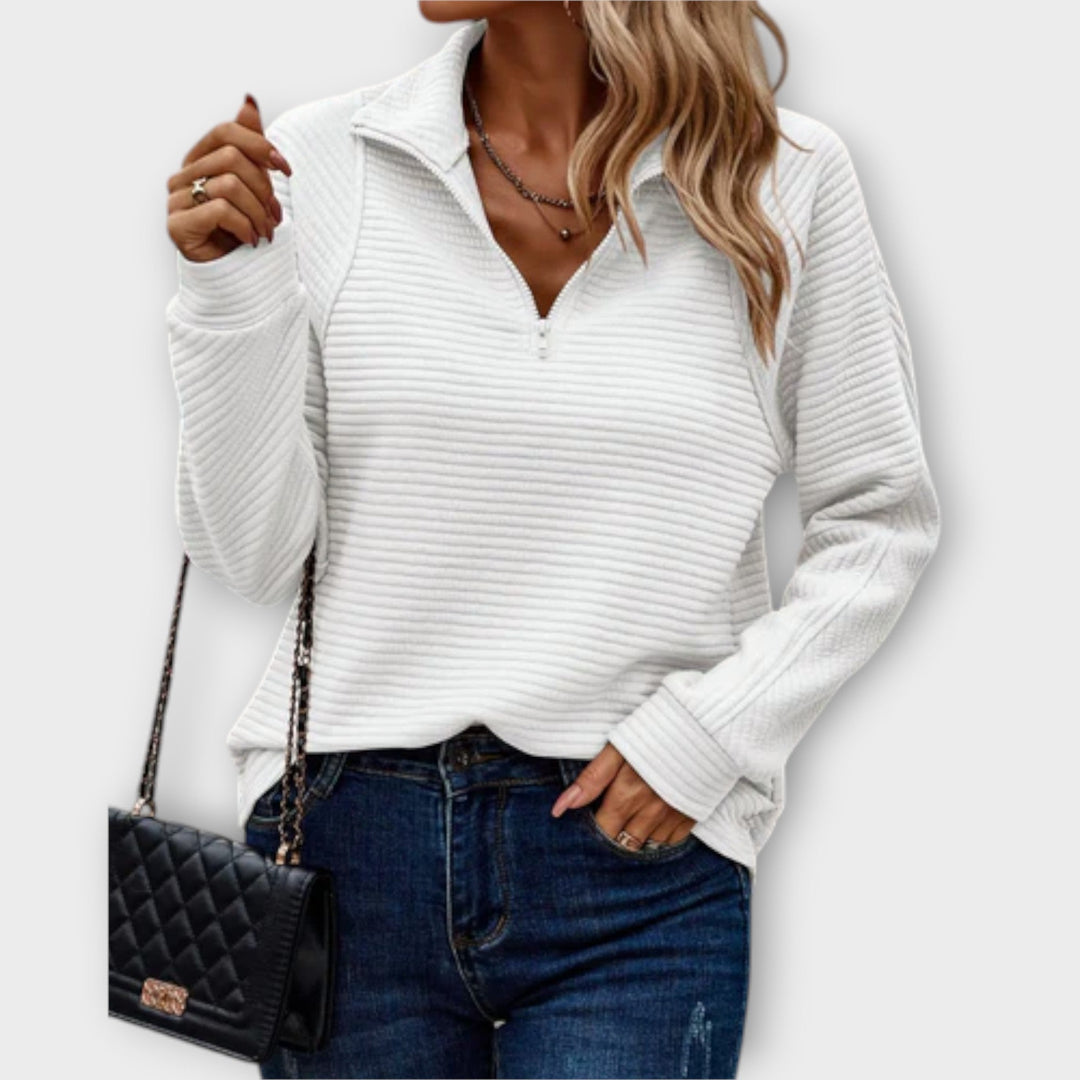 Versatile women's V-neck pullover with zipper. Elegant knitwear for casual outings or layering.