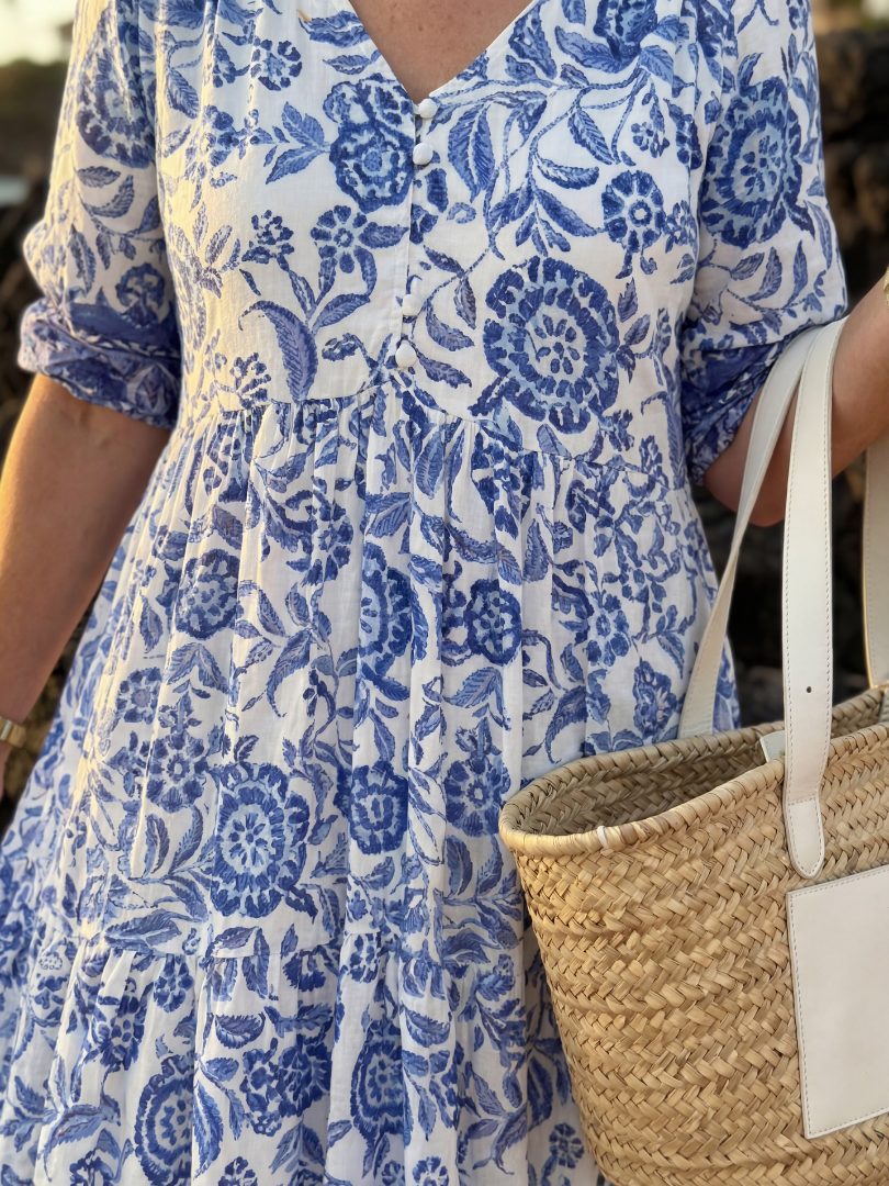 Comfortable women's blue floral midi dress with relaxed fit, elegant V-neck and stylish elbow sleeves.